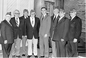 Mayor Raymond L. Flynn posing with unidentified members of South Boston (Veterans of Foreign wars) VFW Post 6536