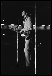 Paul McCartney, full-length portrait, performing with the Beatles at D.C. Stadium