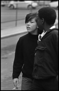 Two young boys watching the Counter-inaugural demonstrations, 1969, one with with cigarette in hand
