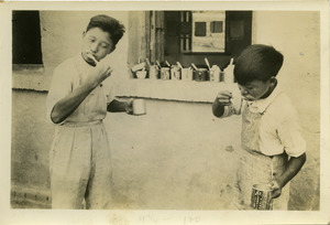 Chinese boys brushing teeth