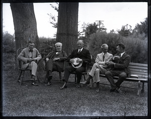 Group sitting on Windsor chairs on the lawn at the Fireside Inn: Harvey Firestone, Thomas A. Edison, Massachusetts Governor Alvan T. Fuller, Henry Ford, and Alton Blackington (?) (l. to r.)