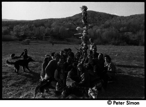 Revelers seated around the Maypole, Packer Corners commune