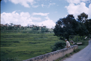 Man sits on a wall in Kathmandu Valley
