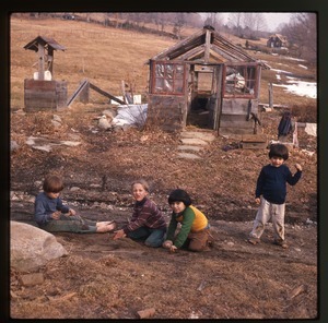 Children playing in front of the greenhouse, Montague Farm Commune