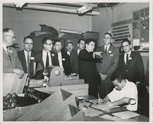 Attendees observe an ICD client at work at the 1959 Rehabilitation Counselors Conference