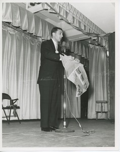 Performer on stage at Thanksgiving celebration