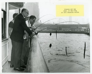 Dr. DiMichael fishing with clients on the annual boatride