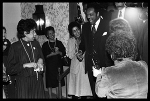 Jesse Jackson greeting supporters as he enters the room