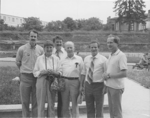 Dr. Chester Ellsworth Cross standing outdoors with group of people