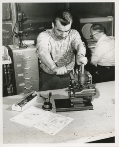 Felix Lambrelli repairs a gasoline engine at TOWER mechanic training