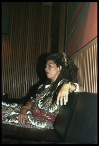 Rosalind Cash: seated on a couch