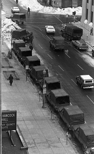 Pedestrians and parked Military Police vehicles on Stuart Street