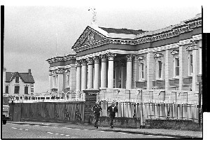 Gusty Spence jogging past the Crumlin Road Court House where his trial took place, shortly after his release from prison