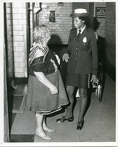 [Two unidentified women standing in hospital hallway]