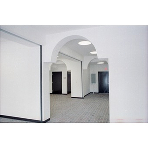 Archways in a newly constructed suite of commercial or office spaces.