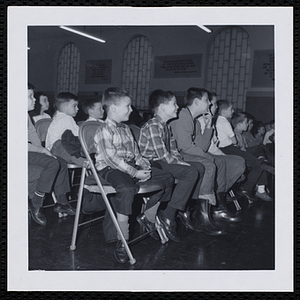 An audience of boys attend a Christmas party