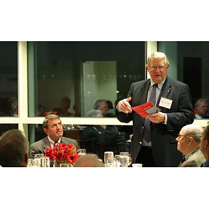 Neal Finnegan speaks to the table at the Veterans Memorial dinner