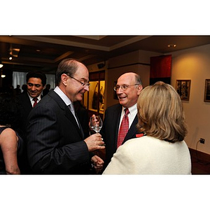 President Aoun speaking to Sy Sternberg during NU Night at the Pops