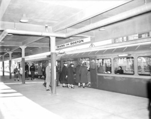 Orient Heights Station with passengers boarding inbound trains