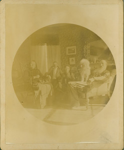 Informal group portrait of the Tucker family and their dog, unknown location, undated