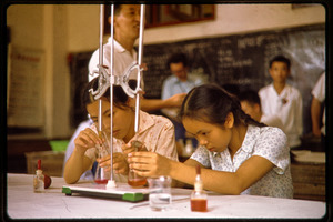 Two girls in a school chemistry lab