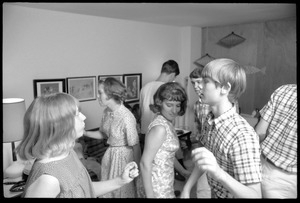 Teenage long hair: boys and girls dancing at a teenage dance party