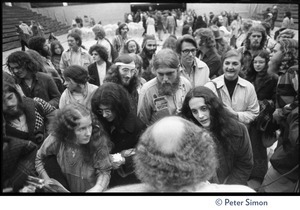 Audience members at the College of Marin gathered in front of the stage to speak to Ram Dass