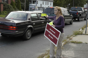 Protest against a pornographic video store in Northampton: protester handing out fliers to cars on North Street