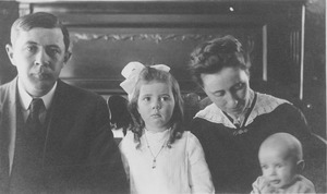 Justus C. Richardson and family sitting indoors