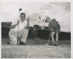 Billy Bruckner and his father posing at a golf course