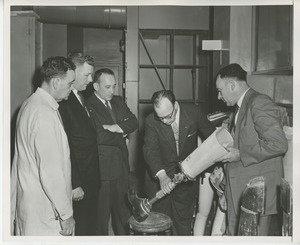 Senator Potter and staff observing a prosthetic leg at Institute Day