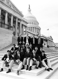 Congressman John W. Olver (rear row, right) with group of visitors, posed on the steps of the United States Capitol building