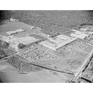 Suburban location of industrial buildings, some new construction, unidentified