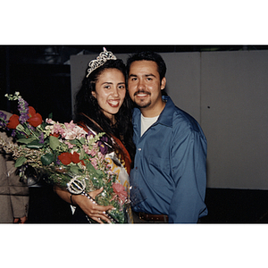 Yaritza Gonzalez, Miss Festival Puertorriqueño 1996, and a man pose together