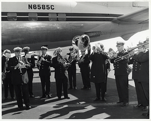 American Cerebral Palsy Band playing in front of an airplane
