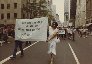 Sylvia Rivera holding a banner at Christopher Street Liberation Day Parade 1983