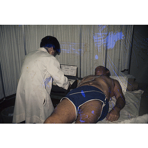 Man lying down receiving an electrocardiogram test