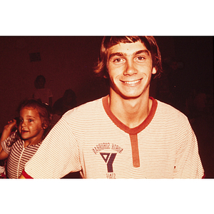 Young man wearing North Suburban YMCA shirt
