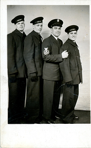 Daniel Correa standing with fellow Navy seamen