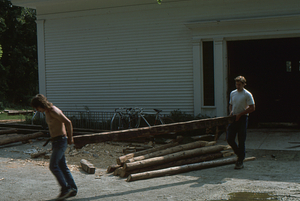 Moving barn beams from the Carriage House before the Moon Barn Raising at entrance to Hopkins Forest on 2 August 1975.