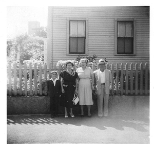 Loureiro family in front of fence