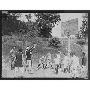 Youth playing basketball at Camp School, Allston