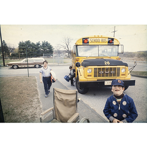 Children exiting a school bus outside the YMCA