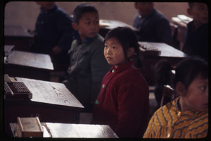 Hsiao Ying Primary School -- girl at desk, other looking over her shoulder