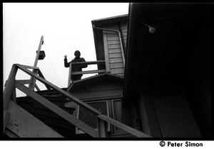 Verandah Porche standing at the top of a steep exterior staircase to a house