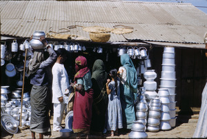 Women shop for cooking pots