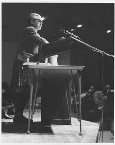 Hugh MacDiarmid, standing at podium