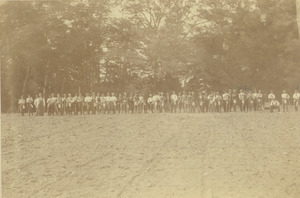 Class of 1882 lined up on a plowed field