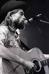 New Riders of the Purple Sage opening for the Grateful Dead at Sargent Gym, Boston University: John 'Marmaduke' Dawson playing acoustic guitar and singing