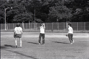 Boston Phoenix vs. WBCN staff softball game: catch in the outfield, Danny Schechter on right